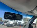Interior view of a 2012 Chevrolet Express with a rearview mirror displaying a camera feed and a clear view of the dashboard