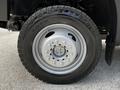 Close-up of a silver wheel with a tire labeled Toyo M55 on a 2016 Ford F-550