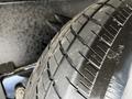 A close-up of a tire from a 2022 Heartland Torque showing tread patterns and surface details