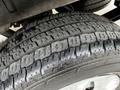 A close-up view of a tire on a 2020 Ford Transit showing its tread pattern and rubber texture