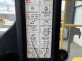 Control panel of a 2006 John Deere 470G featuring various operation instructions and symbols for equipment functions