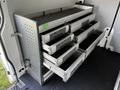 A 2017 Mercedes-Benz Sprinter interior with multiple metal storage drawers organized on shelving units