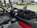 Interior view of a 2018 Hino 195 showing the dashboard steering wheel gear shift and control panel with navigation screen