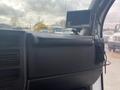 Interior view of a 2016 Chevrolet Express showing the dashboard with a small monitor mounted on it