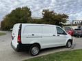 White 2019 Mercedes-Benz Metris cargo van with a sleek design and large rear doors parked on a street