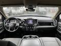 Interior view of a 2020 RAM 3500 showcasing the dashboard steering wheel and center console with a touchscreen display and control buttons