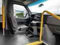 Interior view of a 2016 Ford Econoline showcasing the driver's seat dashboard and gear console