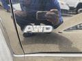 A close-up view of the AWD badge on the side of a 2015 Kia Sorento