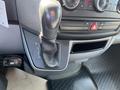 A gear shift lever in a 2010 Mercedes-Benz Sprinter with markings for park reverse neutral and drive