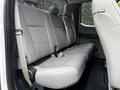 The interior of a 2017 Ford F-250 showing a grey cloth rear bench seat with seatbelts and a clean, spacious cabin layout