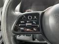 Steering wheel controls of a 2019 Mercedes-Benz Sprinter featuring buttons for cruise control settings and functions
