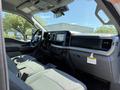 Interior of a 2023 Ford F-550 showing the dashboard front seats and infotainment system with modern design and features