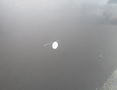 Image of a 2020 Chevrolet Express revealing a small dent and scratch on its surface