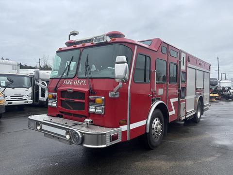 A red 2006 E-One Fire Truck with "FIRE DEP'T" written on the front, featuring multiple lights on the roof and a large grill on the front end