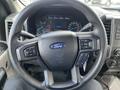 Steering wheel of a 2017 Ford F-250 SD with buttons for audio control and cruise control visible