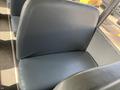 A blue seat inside a 2007 Blue Bird Vision school bus