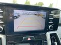 A rearview camera display showing guidelines on a dashboard screen of a 2022 Kia Sorento