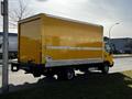 A yellow 2017 Hino 155 box truck parked with a partially visible rear and side view