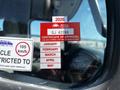 A 2004 Freightliner M2 displaying a 2026 certificate of approval sticker for British Columbia on the windshield