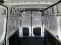 Interior of a 2021 Mercedes-Benz Sprinter van showing a spacious cargo area with white walls and a flat floor devoid of any cargo or equipment