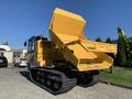 A yellow 2022 TerraMac Tracked Dump with a raised dump body and caterpillar tracks, designed for hauling and dumping materials on various terrains