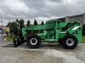 A green 2014 JLG 10054 telehandler with large black tires and a black fork attachment at the front
