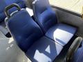 Two blue fabric seats designed for a 2019 Chevrolet Express with a textured surface and ergonomic design