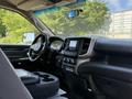 Interior view of a 2020 Ram 2500 showing the dashboard steering wheel and center console with infotainment system controls and cup holders