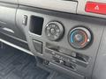 Control panel of a 2009 Toyota Hiace with knobs for air conditioning and heating settings