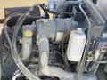 Close-up of the engine components of a 2010 Kubota F3680 with hoses wires and a visible coolant reservoir