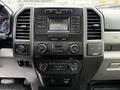 Dashboard of a 2019 Ford F-350 SD featuring climate controls audio system and various buttons and displays