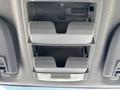 Interior overhead console with two gray storage compartments designed for holding small items in a 2014 Ford F-250 SD
