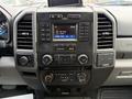 The dashboard of a 2017 Ford F-350 SD featuring a central touchscreen display and various control buttons for audio and climate settings