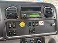 Dashboard of a 2016 Freightliner 108SD featuring a radio control panel and various buttons for vehicle functions