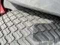 Close-up of a tire from a 2012 Toro Groundsmaster 5910 showing detailed tread patterns and wear on the rubber surface