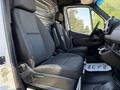 2020 Mercedes-Benz Sprinter interior featuring two black fabric seats and a control panel on the dashboard