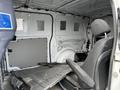 Interior view of a 2018 Mercedes-Benz Metris showing the empty cargo space and a driver's seat without any additional equipment or upholstery