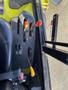 Close-up of the control panel of a 2010 Kubota F3990 featuring levers and switches for operating the machine