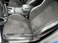 2022 Dodge Charger front driver's seat featuring black fabric and leather upholstery with a slightly worn texture