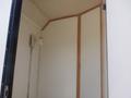 Interior of a 2004 Royal 18 Foot Office Trailer featuring wooden trims and a wall-mounted light fixture