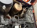 Close-up of the engine compartment of a 2018 Doosan DL300 -5 showing various components including filters pipes and the air intake system