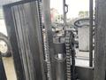 A 2011 Toyota 028FG15 forklift with a visible chain and lifting mechanism in the foreground