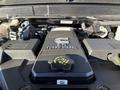 Close-up of the engine cover of a 2023 RAM 3500 featuring a 6.7L turbo diesel logo and engine oil cap