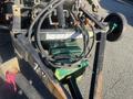 A 2017 R&R Reel with visible hydraulic hoses and a green block component positioned on a metal frame