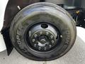 2022 Blue Bird BB Conventional bus tire showcasing a black wheel with a sturdy tread and multiple lug nuts