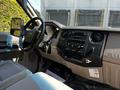 Interior view of a 2008 Ford F-550 showcasing the dashboard with controls and a spacious seating area