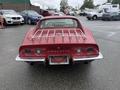 A red 1970 Chevrolet Corvette with a distinctive rear design featuring round taillights and a chrome bumper