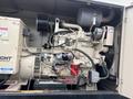 A 2005 Katolight SED60FPJ4 generator featuring an engine with various components including pipes wires and a battery pack