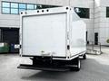 A white 2021 Ford E-450 box truck with a rear step bumper and no visible branding