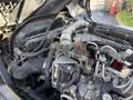 Close-up of a 2014 Hino 195 engine showing various components including hoses wires and the engine block